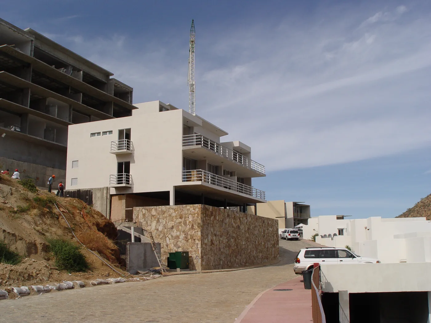 Early Las Cascadas buildings under construction on the Pedregal hillside